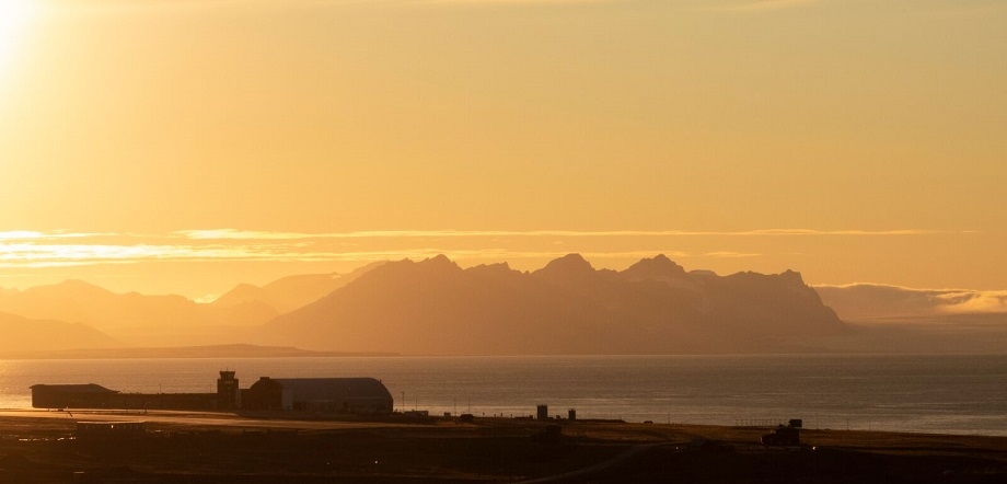 Longyearbyen airport in golden midnight summer sun. Credit: Håkon Daae Brensholm - Visit Svalbard